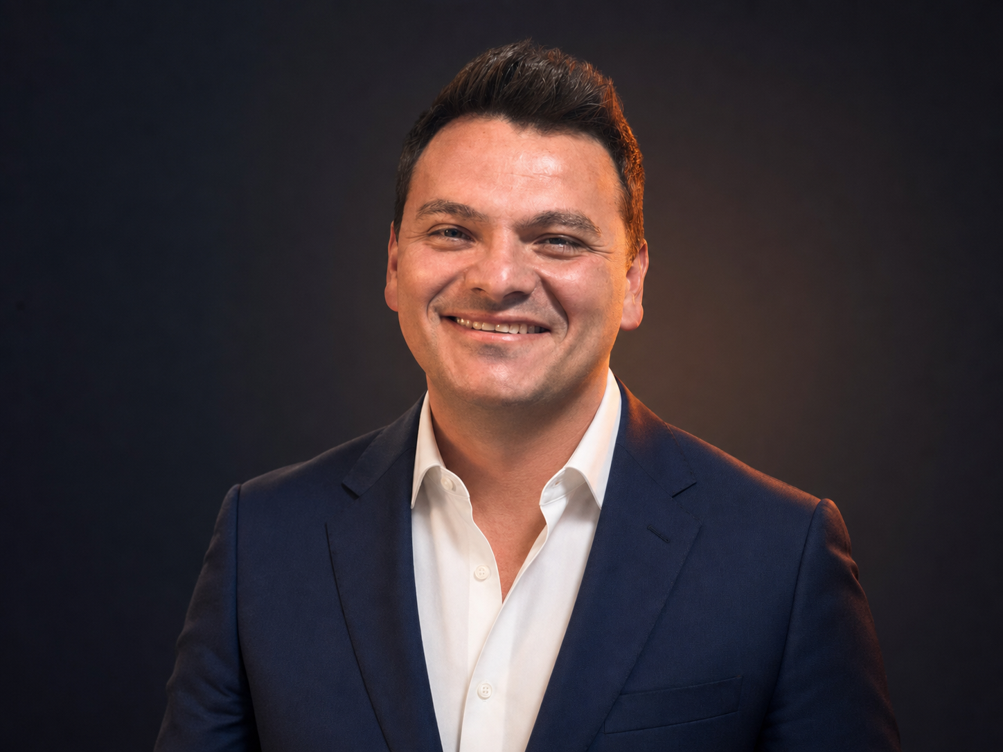 Professional studio portrait of Luis Mondini
