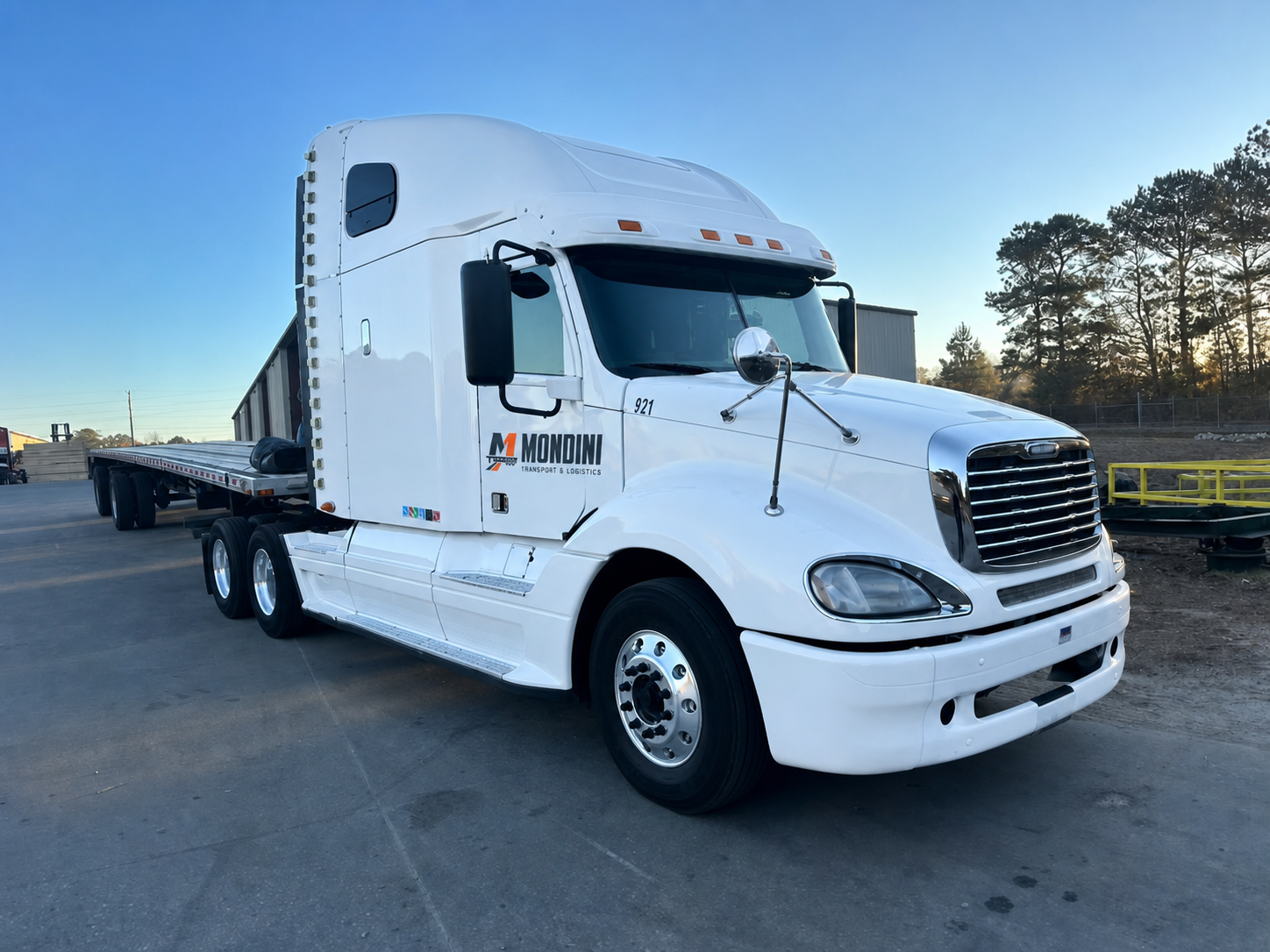 White Mondini Transport and Logistics flatbed truck with updated branding